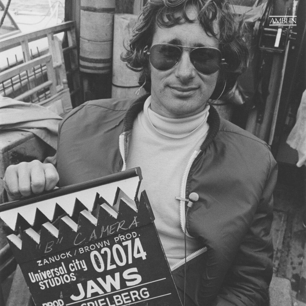 On location in 1974, at sea off of Martha’s Vineyard, holding the cleverly and aptly modified slate for his breakthrough blockbuster, Jaws.